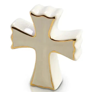 Decorative cross with gold trim on a white background