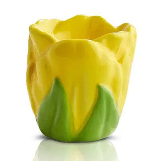 Yellow tulip-shaped candle holder on a white background
