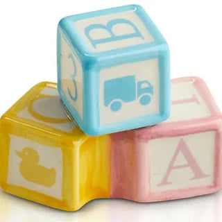 Colorful baby blocks with letters and symbols on a white background