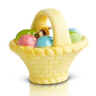 Yellow ceramic basket with colorful eggs on a white background