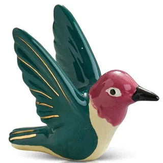 Decorative ceramic bird figurine with green wings and red head on a white background
