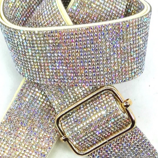 Sparkling belt with a gold buckle on a white background
