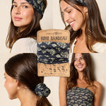 Woman wearing a floral headband and scrunchie with 'Boho Bandeau' packaging.