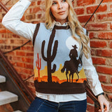 Woman wearing a sweater with desert design against a brick wall
