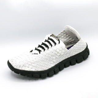 White woven sneaker with black sole on a light gray background