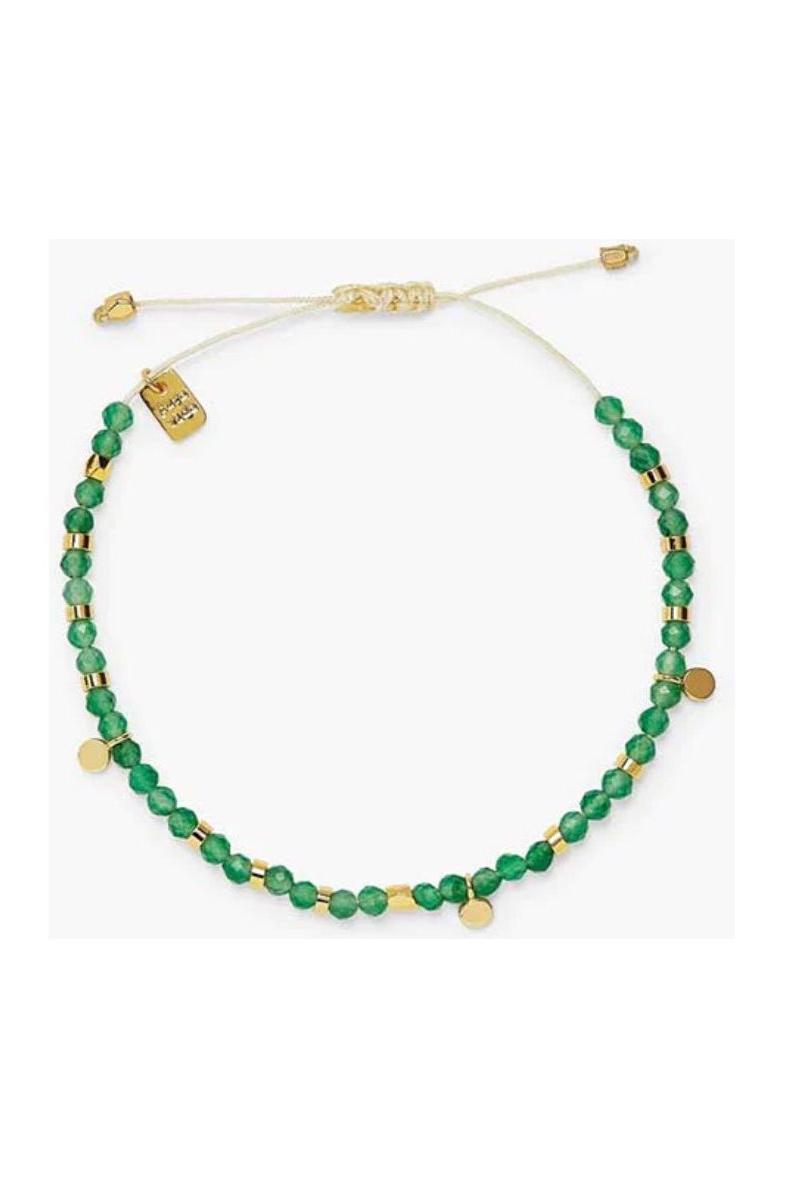 Green beaded necklace with gold accents on a white background