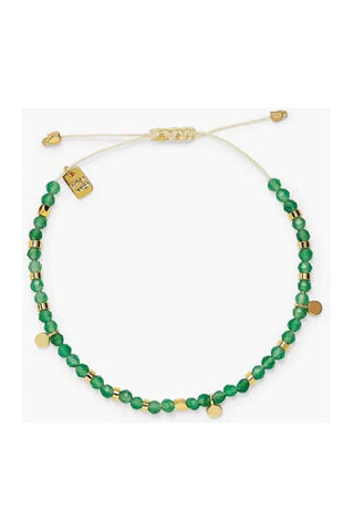 Green beaded necklace with gold accents on a white background