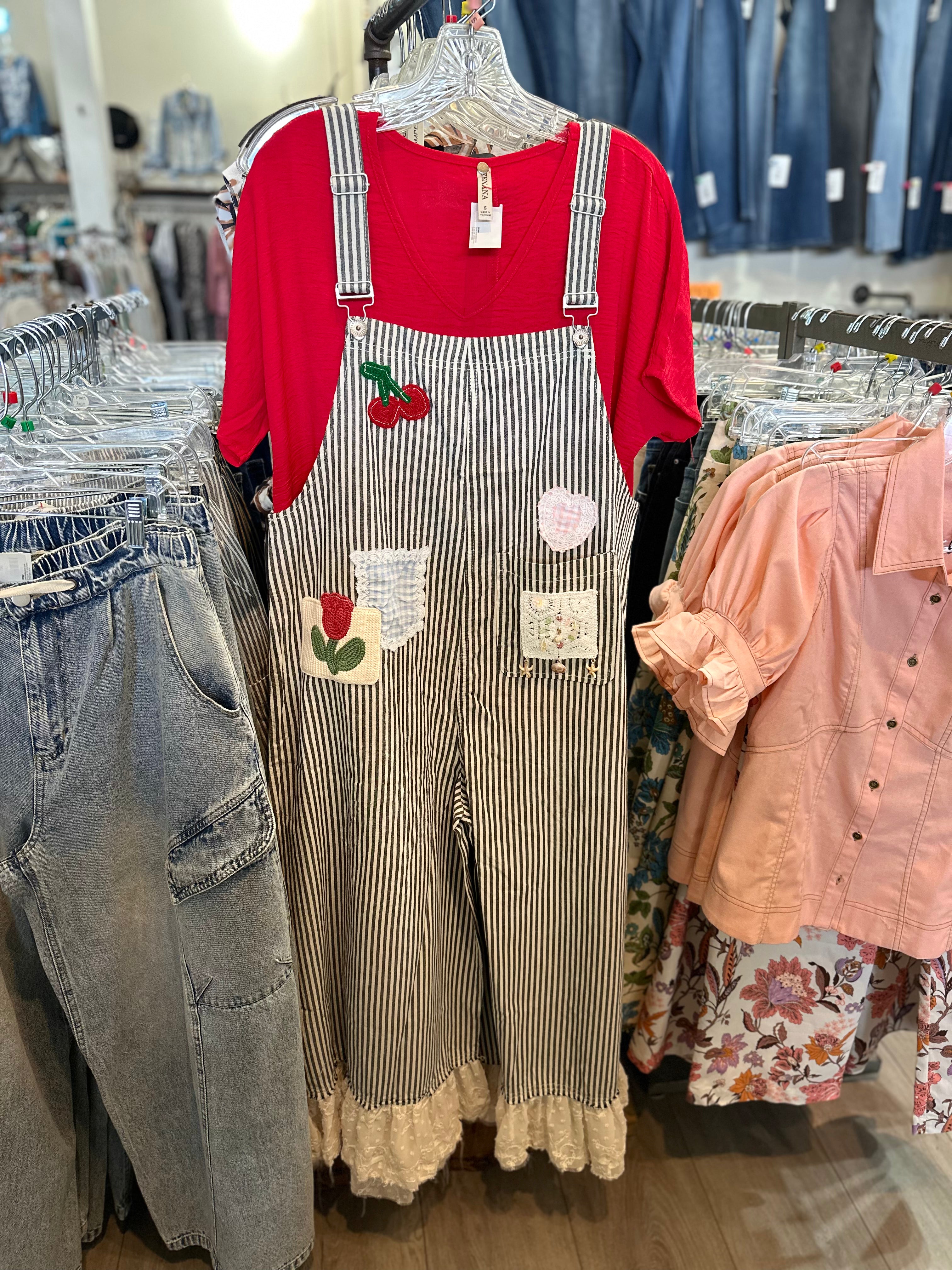 Striped overalls with cherry embroidery on a white background