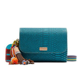 Teal handbag with colorful tassels on a white background