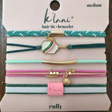 Set of hair tie and bracelets on a display card with 'klani' branding.