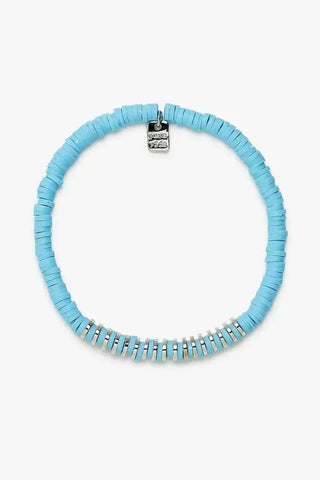 Light blue beaded necklace with a silver clasp on a white background