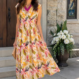 Woman in a floral dress standing outside a building with a stained glass window.