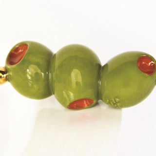 Three green beads with red centers on a white background