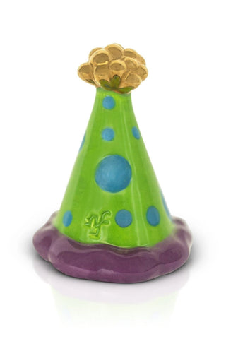 Colorful party hat toy with a green base, purple trim, blue polka dots, and gold top on a white background.