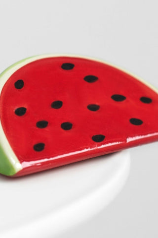 Ceramic watermelon slice on a white background