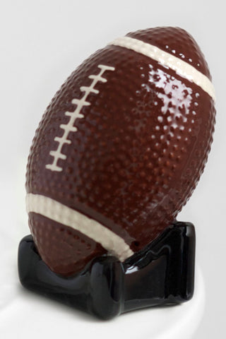 Football with a black holder on a white background
