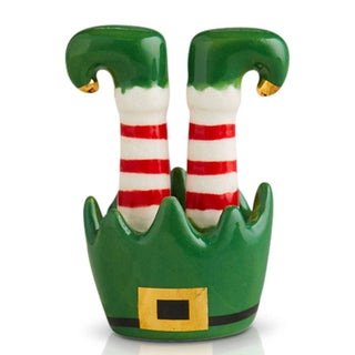 Decorative figurine of elf legs with striped socks on a white background
