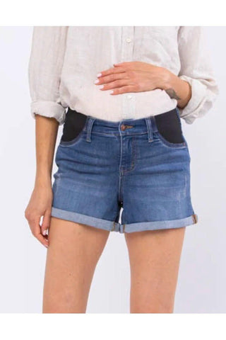 Person wearing blue denim shorts on a white background
