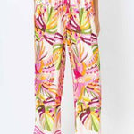 Colorful patterned pants worn by a person on a white background