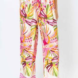 Colorful patterned pants worn by a person on a white background