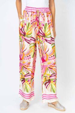 Colorful patterned pants worn by a person on a white background
