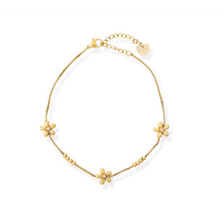 Gold bracelet with floral charms on a white background
