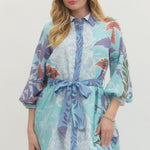 Woman wearing a floral dress with a white background