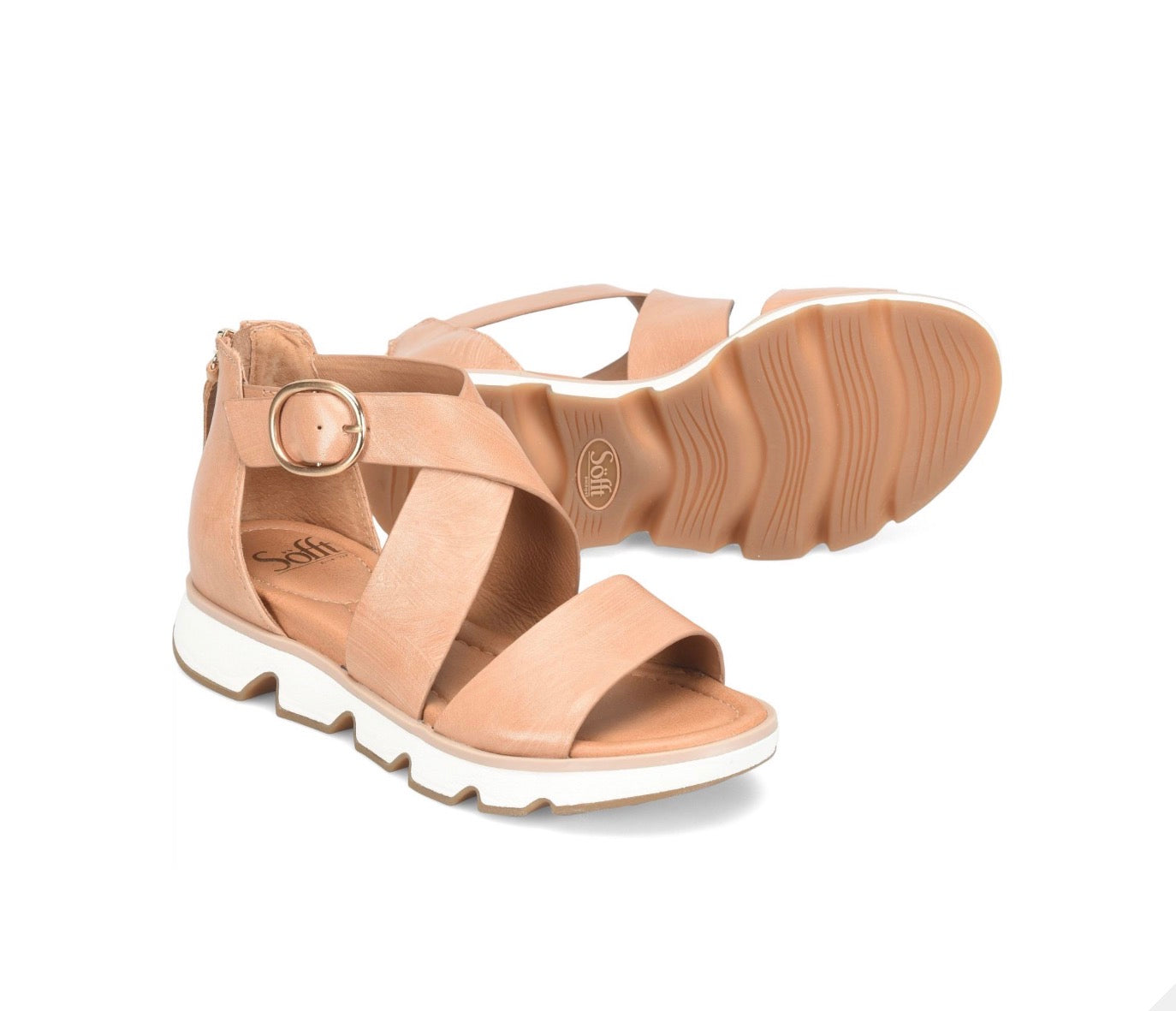 Beige sandals with white soles on a white background