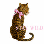 Leopard with a pink bow and 'Stay Wild' text on a white background