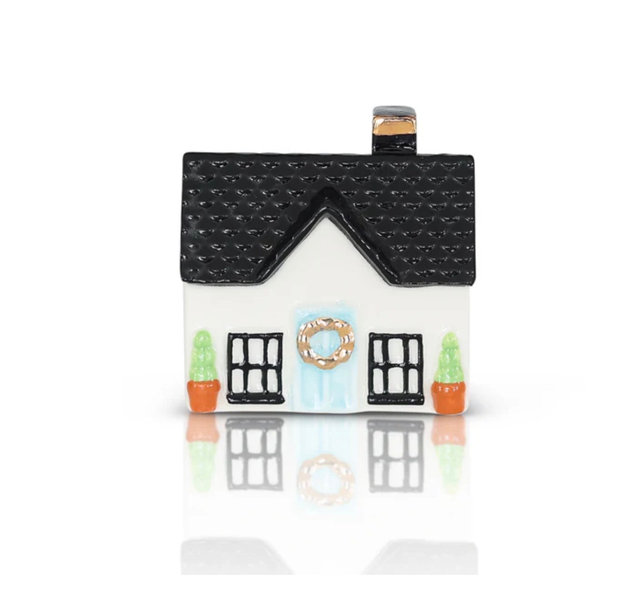 House-shaped container with a black roof and white body on a white background