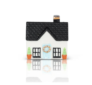 House-shaped container with a black roof and white body on a white background