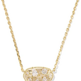 Gold necklace with a pendant on a white background