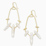 Gold hoop earrings with pearl-like beads on a white background