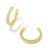 Gold hoop earrings with crystals .