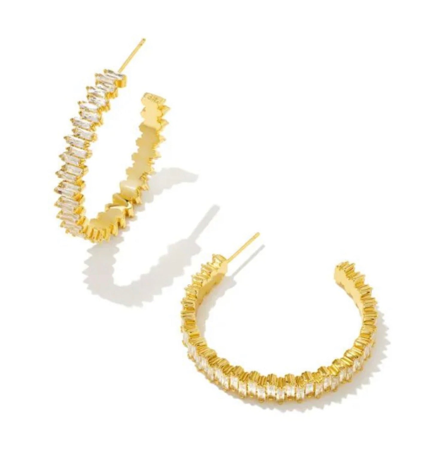 Gold hoop earrings with crystals .