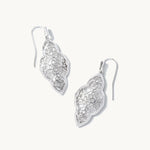 Pair of silver earrings on a white background