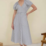 Blue and white striped dress on model