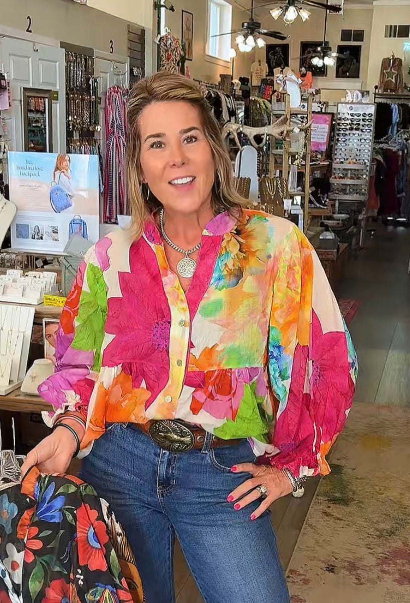 Woman wearing a colorful jacket in a store setting
