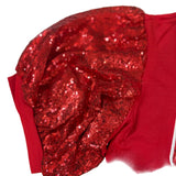 Red sequin headband on a red fabric background
