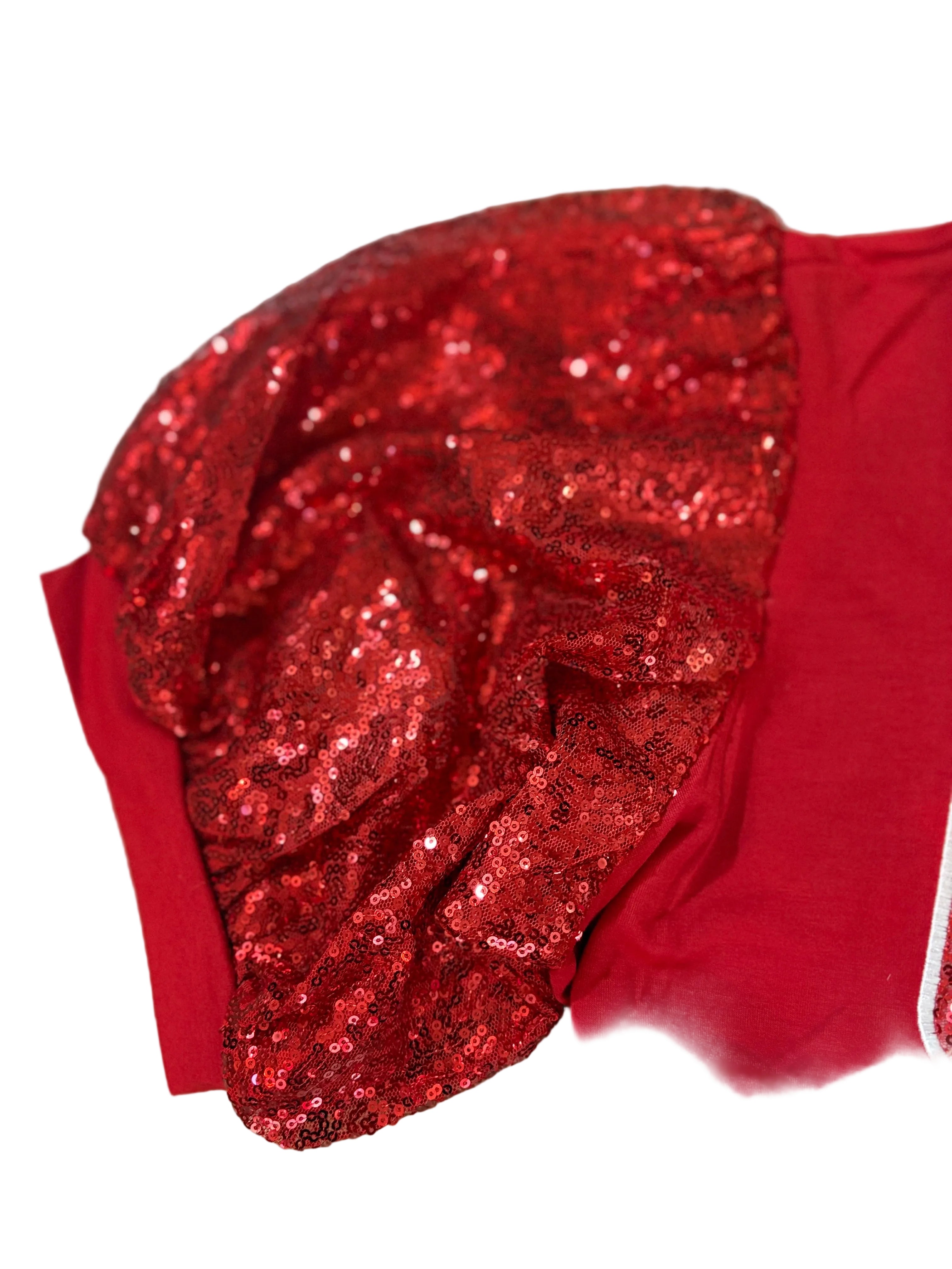 Red sequin headband on a red fabric background