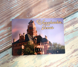 wooden postcard with waxahachie texas courthouse on it.