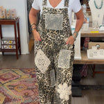 Woman wearing a patterned jumpsuit in a store setting