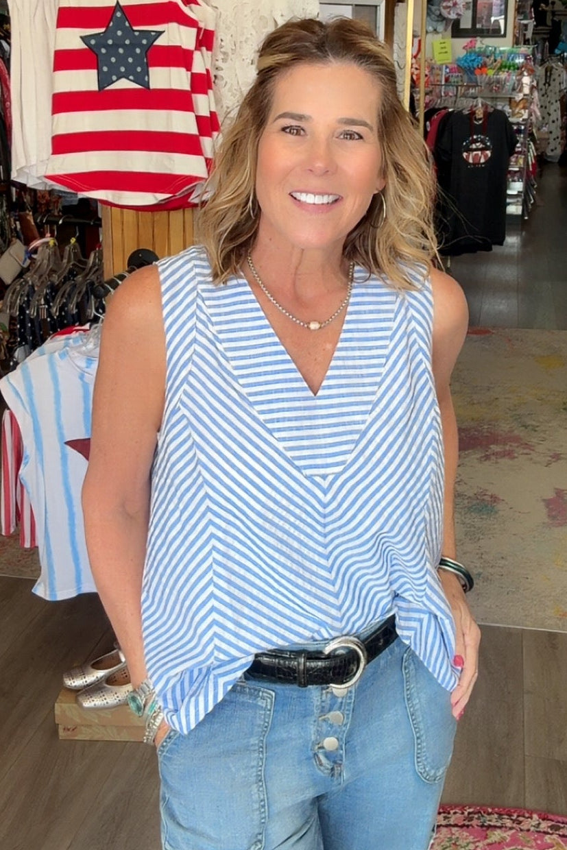 Woman standing in a store with various items on display