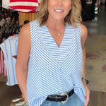 Woman standing in a store with various items on display