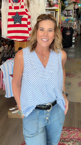 Woman standing in a store with various items on display