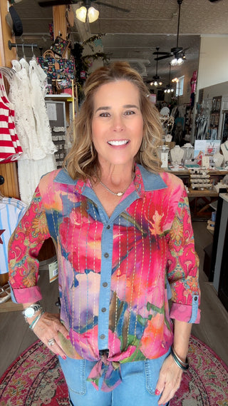 Woman wearing a colorful jacket in a store setting