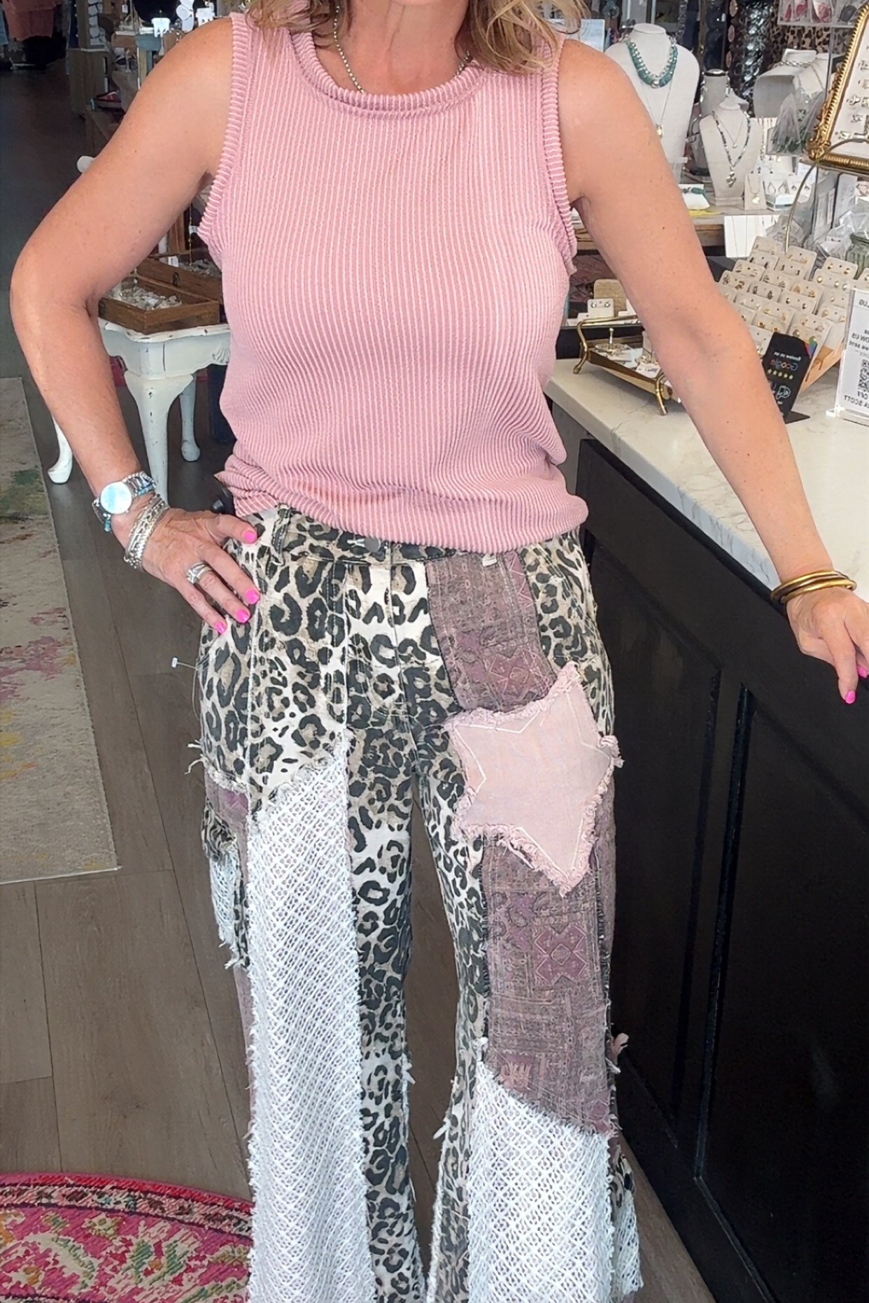 fun printed pants and pink shirt on model