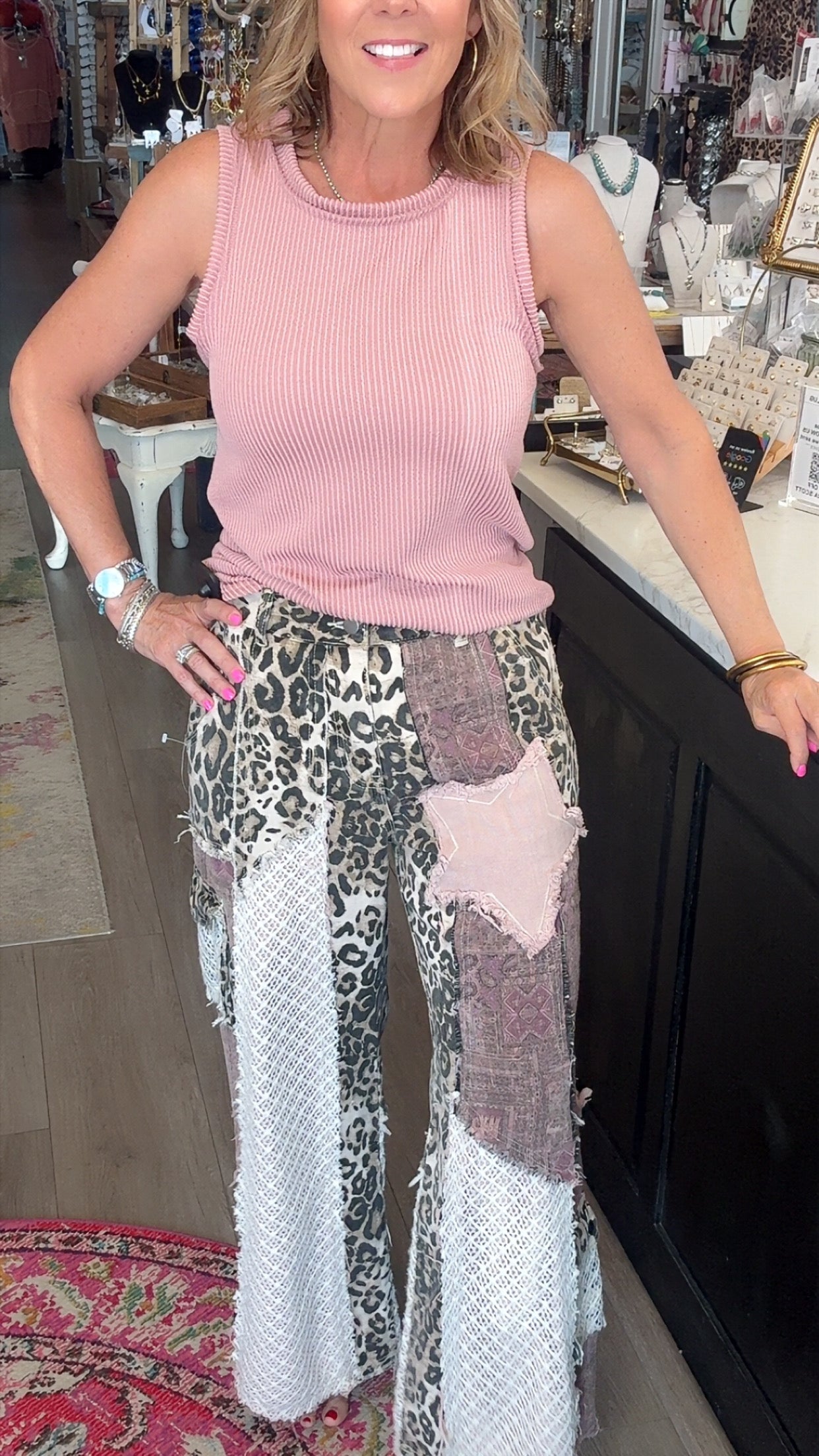 fun printed pants and pink shirt on model