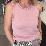 PINK TANK TOP ON MODEL WITH LEOPARD PANTS.