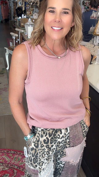 PINK TANK TOP ON MODEL WITH LEOPARD PANTS.